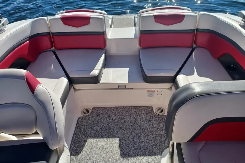 Slide: The Image of 2016 Chaparral Vortex 203 VRX boat interior with red and gray seating. - 7