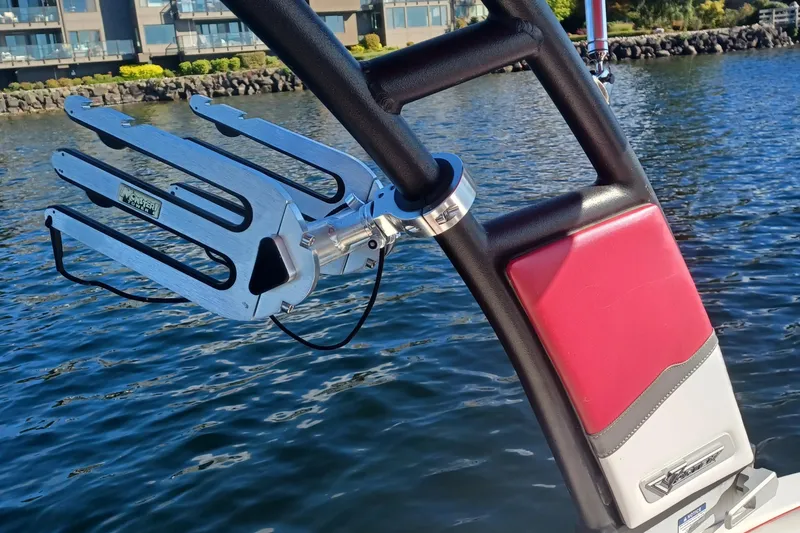 Slide: The Image of 2016 Chaparral Vortex 203 VRX wakeboard rack on water, featuring sleek design and vibrant colors. - 9