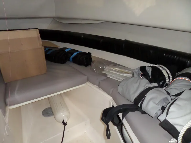 Slide: The Image of Interior cabin of 1999 Sport-Craft 251 WA boat with storage items. - 18