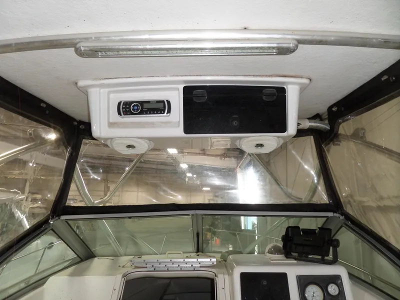 Slide: The Image of Interior view of 1999 Sport-Craft 251 WA boat cabin with dashboard and controls. - 21
