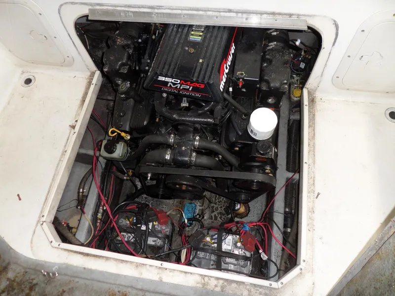 Slide: The Image of 1999 Sport-Craft 251 WA boat engine compartment with 350 MPI motor. - 29