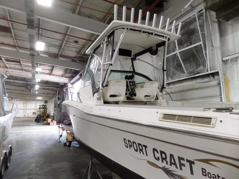 Slide: The Image of 1999 Sport-Craft 251 WA boat in indoor storage facility. - 8