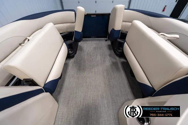 Slide: The Image of Interior of 2025 Tahoe LTZ EL boat with beige and blue seating. - 18