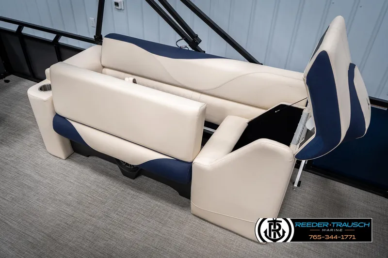 Slide: The Image of 2025 Tahoe LTZ EL boat seating with beige and blue upholstery, featuring cup holders. - 22