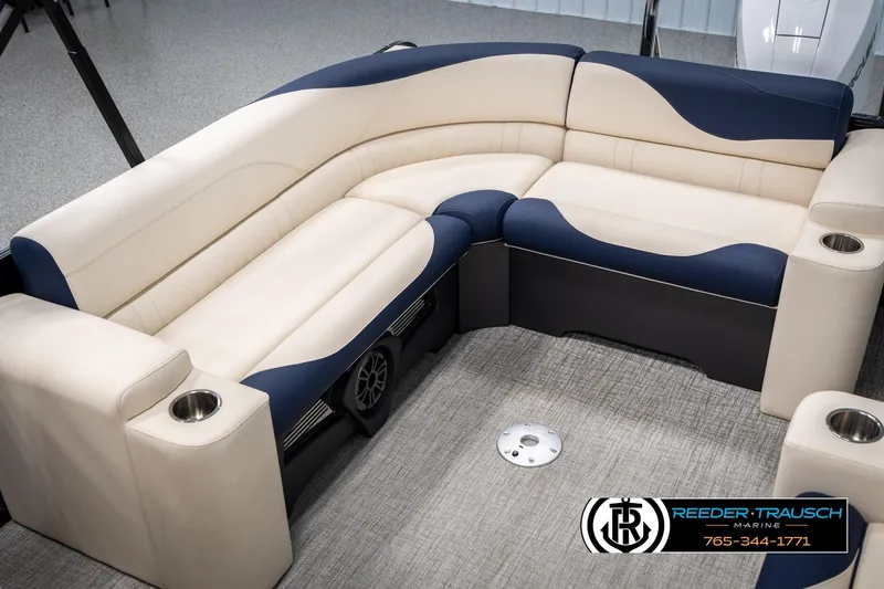 Slide: The Image of Luxurious 2025 Tahoe LTZ EL boat seating with beige and navy upholstery, featuring cup holders. - 23