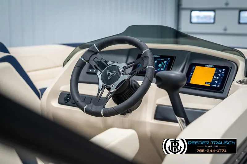 Slide: The Image of 2025 Tahoe LTZ EL boat dashboard with modern steering wheel and digital displays. - 26