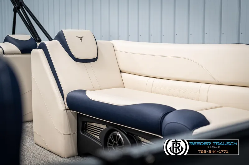 Slide: The Image of Luxurious 2025 Tahoe LTZ EL boat seating with beige and navy upholstery. - 33