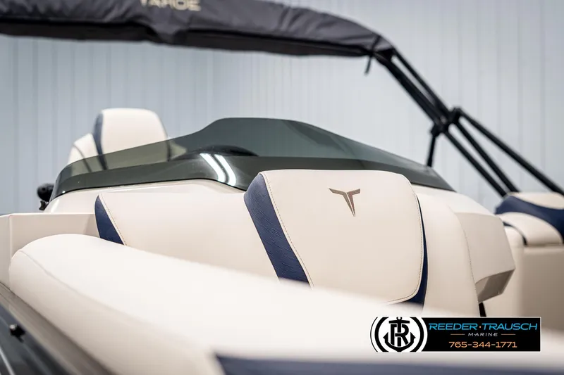 Slide: The Image of 2025 Tahoe LTZ EL boat interior with beige and blue seating, Reeder-Trausch Marine logo. - 34