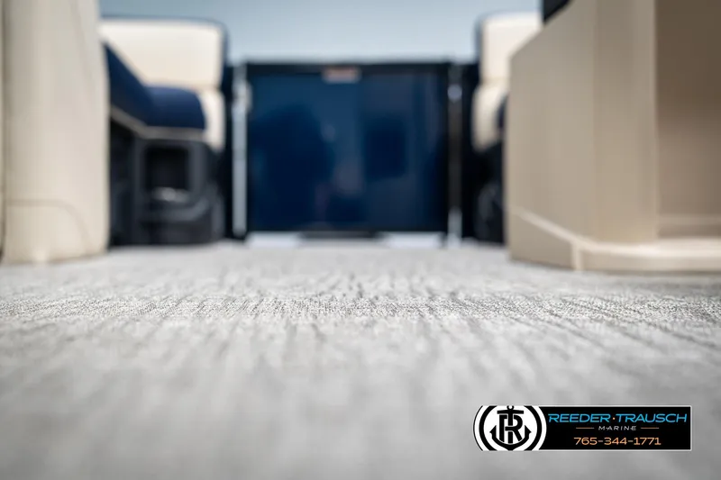 Slide: The Image of Interior view of 2025 Tahoe LTZ EL boat with carpet flooring and seating. - 37