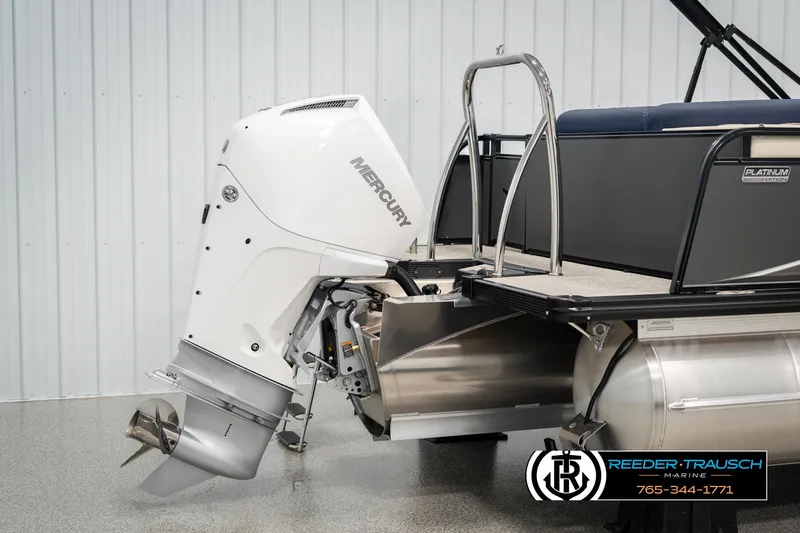 Slide: The Image of 2025 Tahoe LTZ EL boat with Mercury outboard motor, displayed in a showroom. - 38