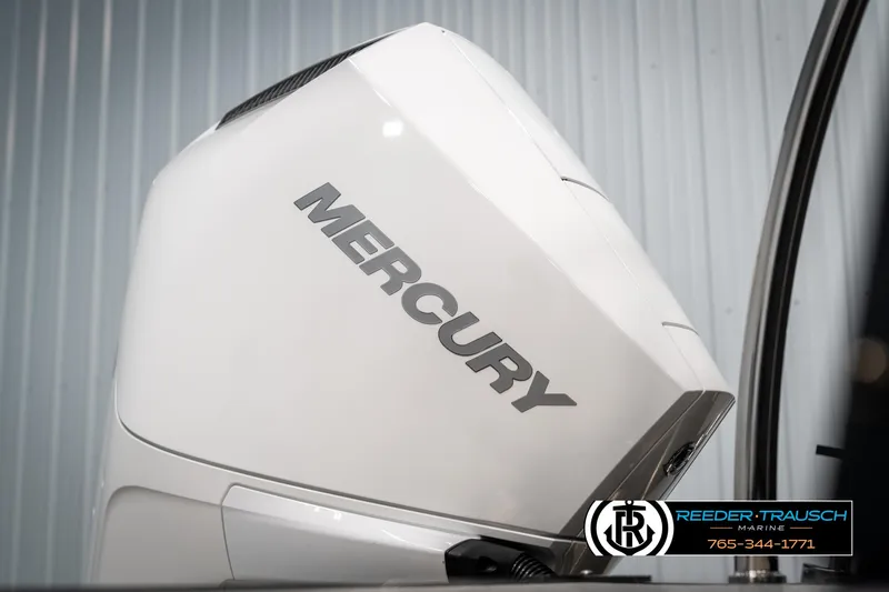 Slide: The Image of White Mercury outboard motor on a 2025 Tahoe LTZ EL boat, Reeder-Trausch Marine logo visible. - 39