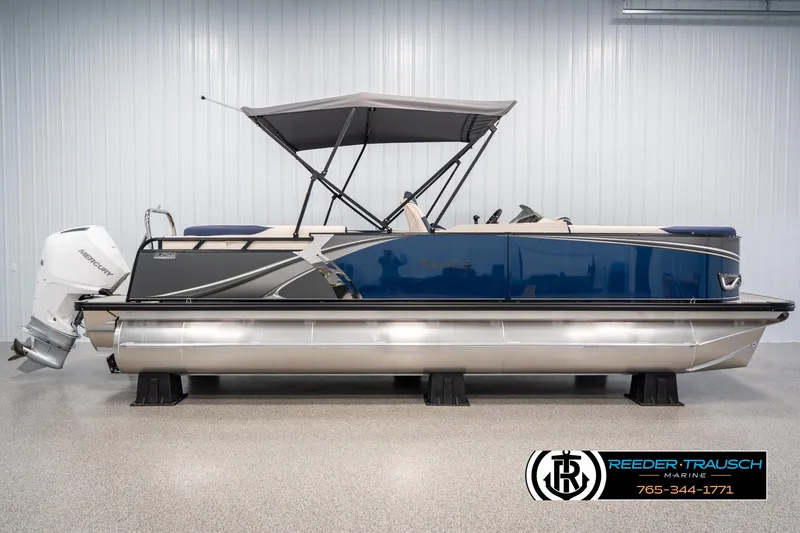 Slide: The Image of 2025 Tahoe LTZ EL pontoon boat with Mercury outboard motor in showroom. - 4