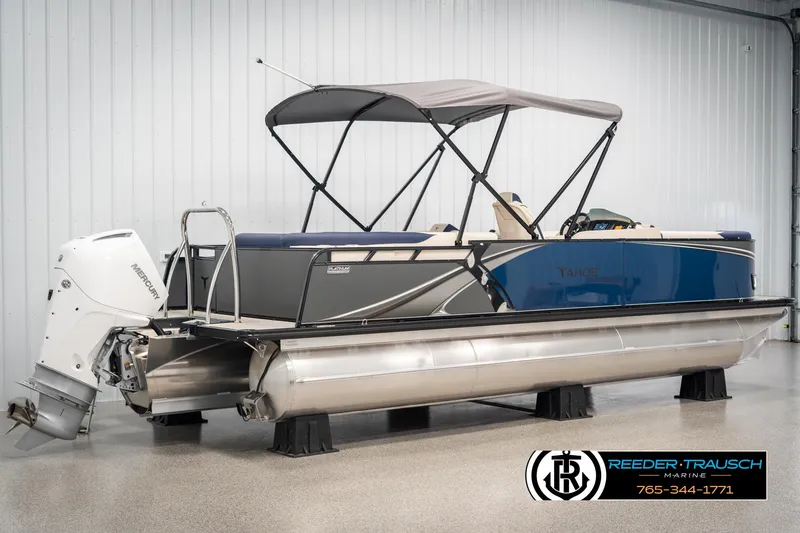 Slide: The Image of 2025 Tahoe LTZ EL pontoon boat with Mercury outboard motor in showroom. - 5
