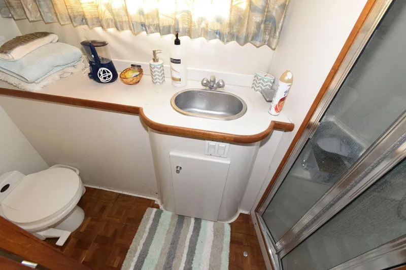 Slide: The Image of Bathroom interior of 1994 Carver 440 Aft Cabin Motor Yacht with sink and shower. - 19