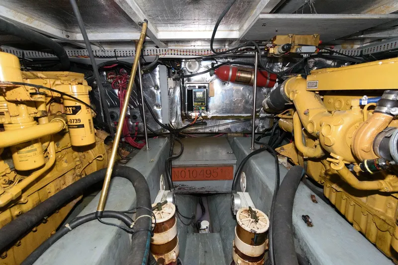 Slide: The Image of Engine room of 1994 Carver 440 Aft Cabin Motor Yacht, showcasing machinery and components. - 22