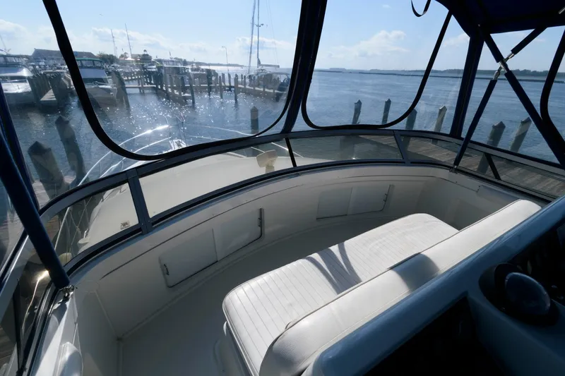 Slide: The Image of 1994 Carver 440 Aft Cabin Motor Yacht interior with marina view. - 9