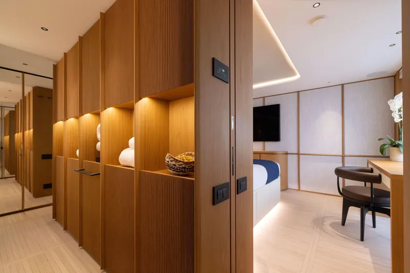 Slide: The Image of Luxurious interior of 2025 Benetti Oasis 34M yacht with modern wood paneling and elegant decor. - 27