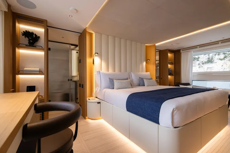 Slide: The Image of Luxurious bedroom interior on 2025 Benetti Oasis 34M yacht, featuring modern design and elegant furnishings. - 29