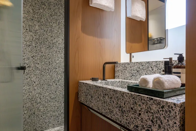 Slide: The Image of Luxurious bathroom in 2025 Benetti Oasis 34M yacht with modern terrazzo sink. - 36