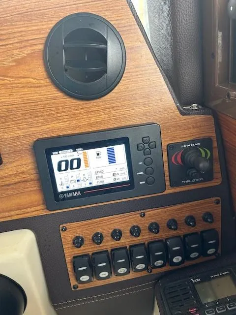 Slide: The Image of 2023 Ranger Tugs R23 dashboard with Yamaha display and control panel. - 15