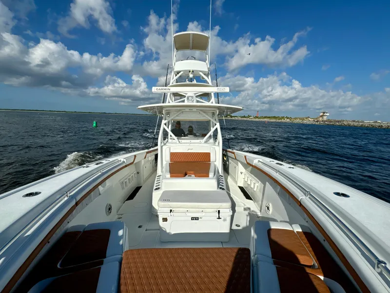 Slide: The Image of 2015 Yellowfin 42 boat on open water under blue sky. - 22