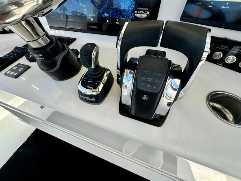Slide: The Image of Control panel of a 2015 Yellowfin 42 boat with advanced navigation equipment. - 35