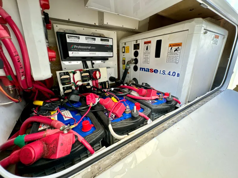 Slide: The Image of 2015 Yellowfin 42 boat battery compartment with Mase generator and wiring. - 46