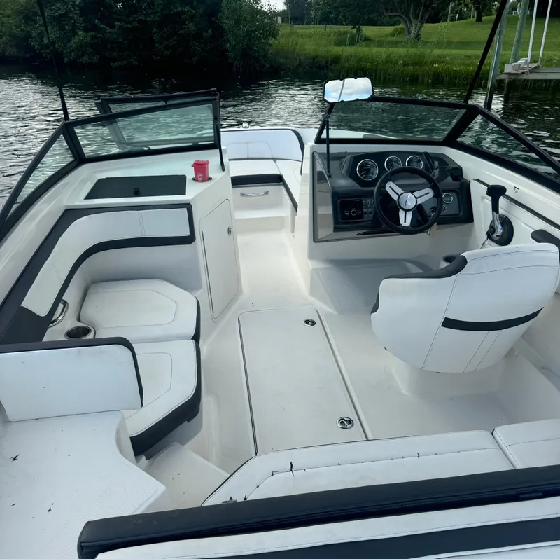 Slide: The Image of 2017 Sea Ray 19 SPX boat interior with steering wheel and seating. - 3
