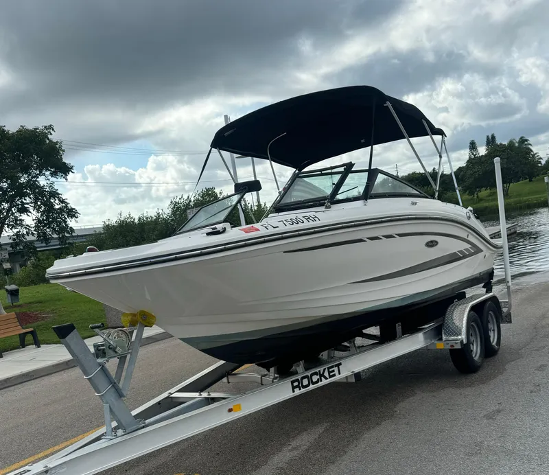 Slide: The Image of 2017 Sea Ray 19 SPX boat on trailer under cloudy sky. - 8