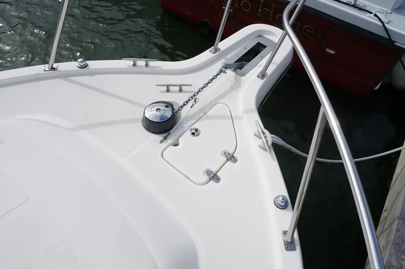 Slide: The Image of 2002 Pursuit 2865 Denali boat deck with anchor chain and railing. - 11