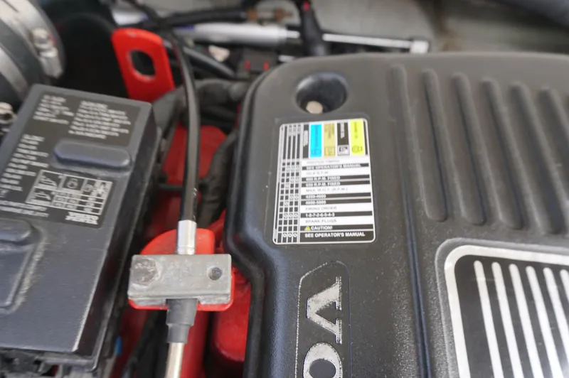 Slide: The Image of Engine compartment of a 2002 Pursuit 2865 Denali, featuring detailed labels and components. - 32