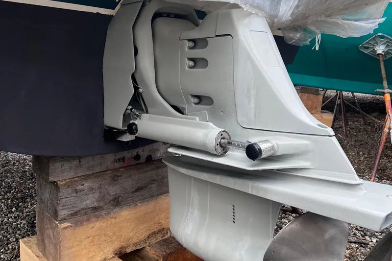 Slide: The Image of 2002 Pursuit 2865 Denali boat engine on wooden blocks, close-up view. - 33