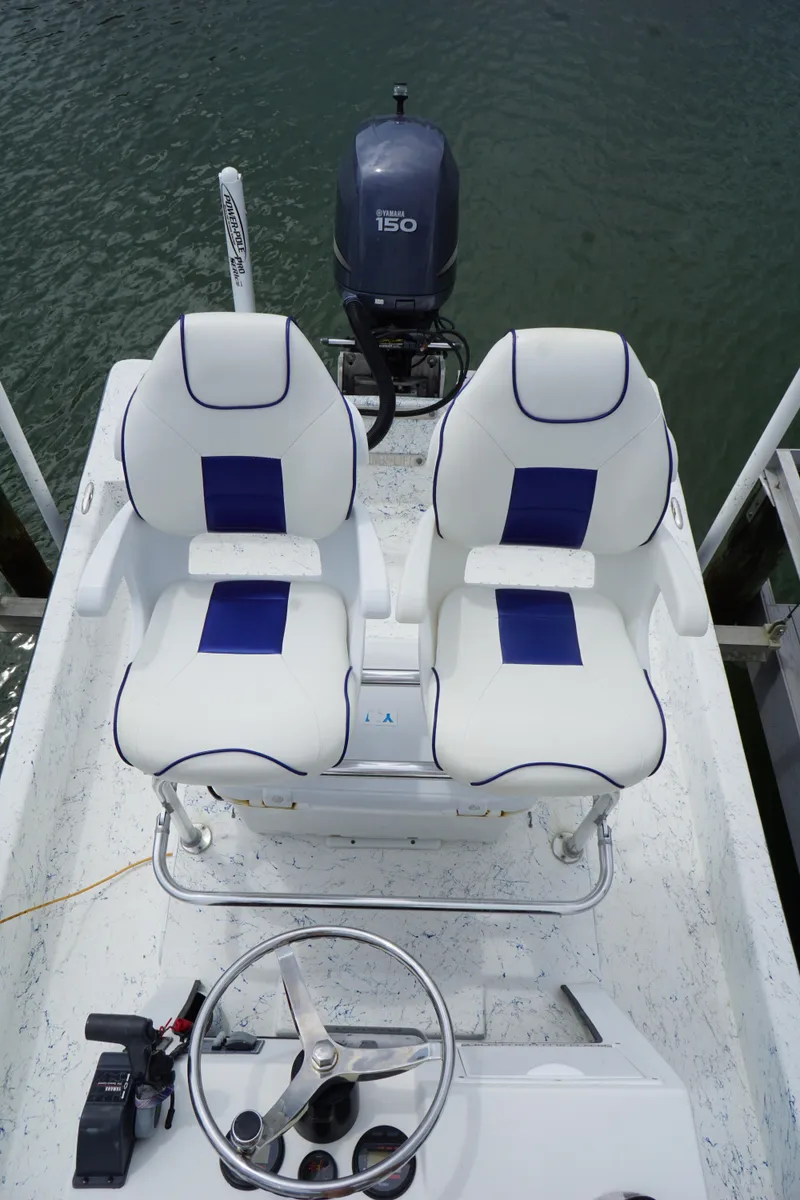 Slide: The Image of 2008 Marshall 21 Topwater Sport boat with dual seats and steering wheel. - 8