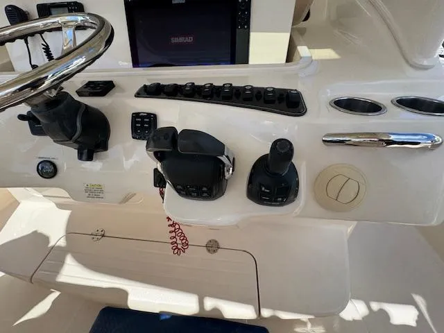 Slide: The Image of Control panel of 2020 Grady-White Canyon 376 boat with steering wheel and switches. - 22