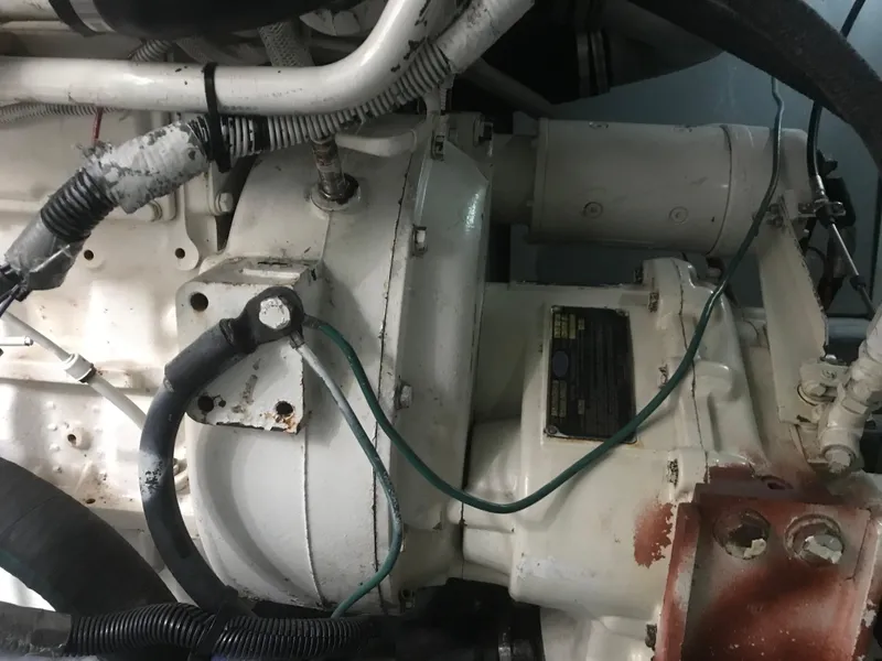 Slide: The Image of Engine compartment of 1995 Sea Ray 450 Sundancer boat, showing mechanical components. - 31