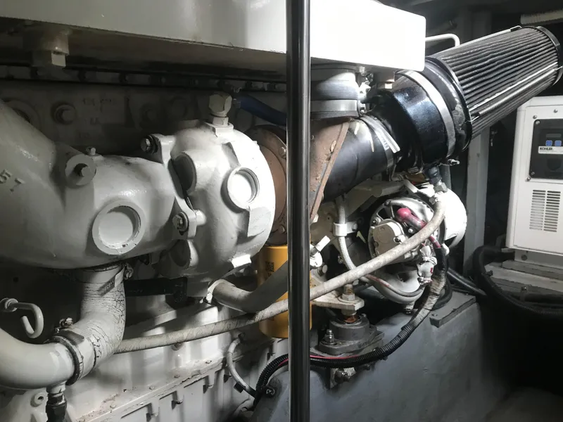 Slide: The Image of Engine room of 1995 Sea Ray 450 Sundancer, showcasing mechanical components and systems. - 33