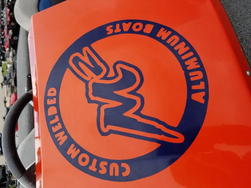 Slide: The Image of Custom welded aluminum boats logo on orange surface, 2012 model. - 6