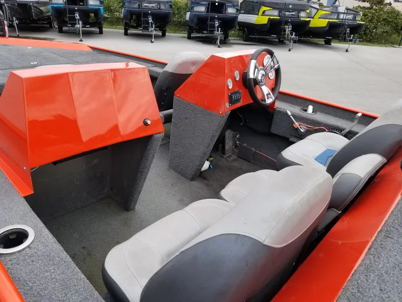 Slide: The Image of Custom 2012 welded boat interior with red dashboard and gray seating. - 7