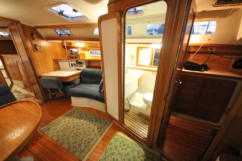 Slide: The Image of Interior of 1993 Catalina 42 MKI sailboat with wood finish and cozy seating area. - 10