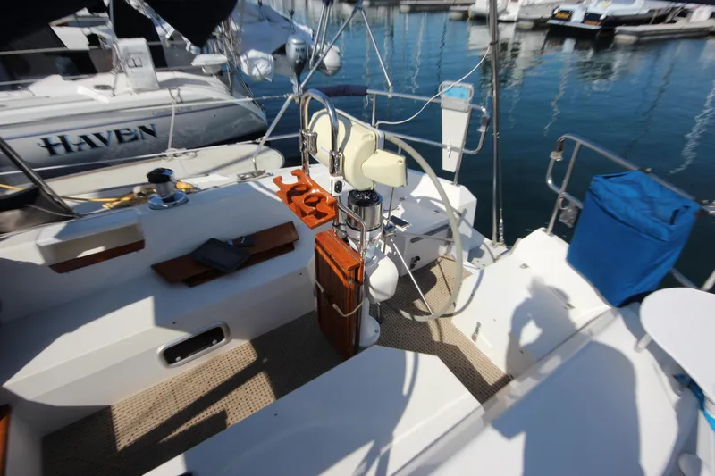 Slide: The Image of 1993 Catalina 42 MKI sailboat cockpit with seating and equipment, docked at marina. - 17