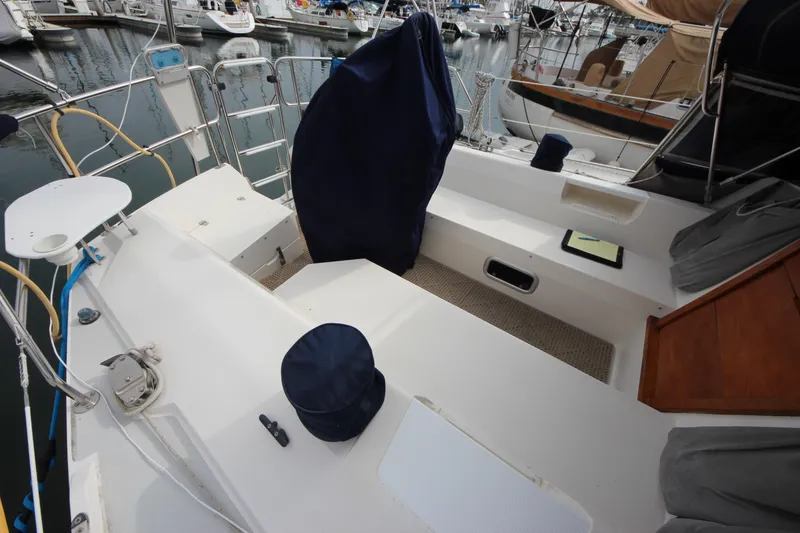 Slide: The Image of 1993 Catalina 42 MKI sailboat cockpit with covered helm, docked in marina. - 21