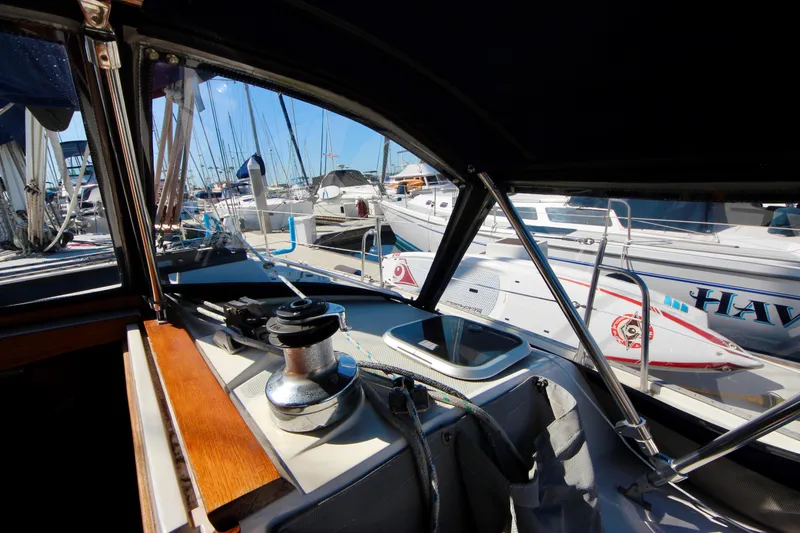 Slide: The Image of Cockpit view of a 1993 Catalina 42 MKI sailboat docked at a marina. - 30