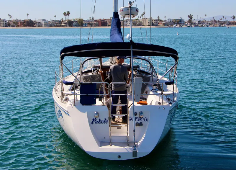 Slide: The Image of Sailboat Catalina 42 MKI 1993 on calm water, rear view, sunny day. - 4
