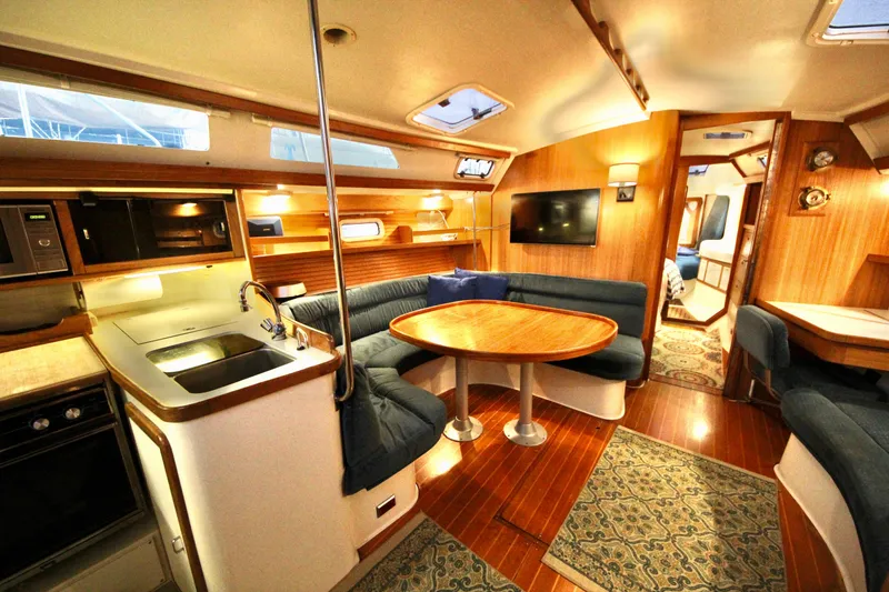 Slide: The Image of Interior of 1993 Catalina 42 MKI sailboat with cozy seating and modern amenities. - 8