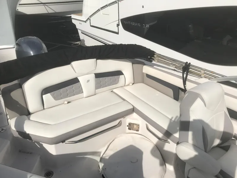 Slide: The Image of 2017 Four Winns HD220 OB boat interior with white seating and modern design. - 17