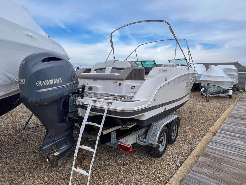 Slide: The Image of 2017 Four Winns HD220 OB boat with Yamaha outboard engine on trailer. - 3