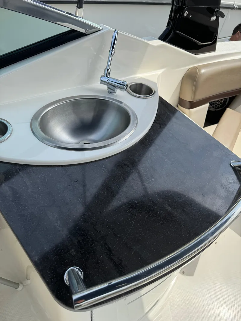 Slide: The Image of 2013 Sea Ray 270 SLX boat sink and countertop detail. - 21