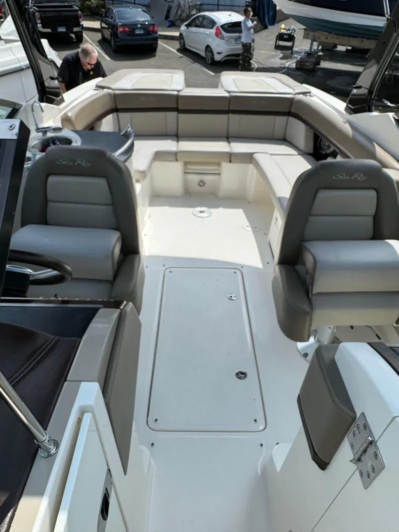 Slide: The Image of 2013 Sea Ray 270 SLX boat interior with spacious seating and modern design. - 22