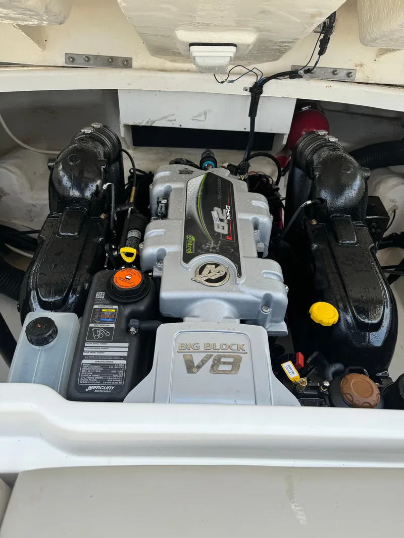 Slide: The Image of 2013 Sea Ray 270 SLX engine compartment with Big Block V8 engine. - 25