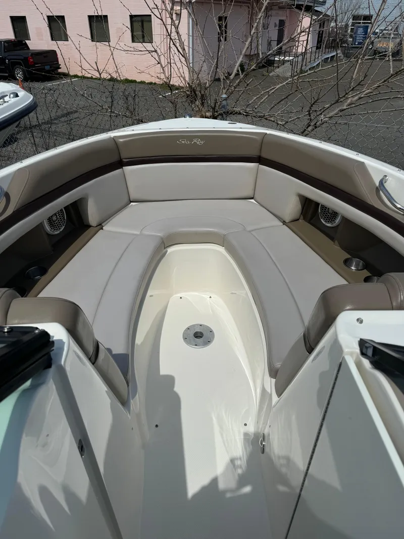 Slide: The Image of 2013 Sea Ray 270 SLX boat interior with beige seating and sleek design. - 33